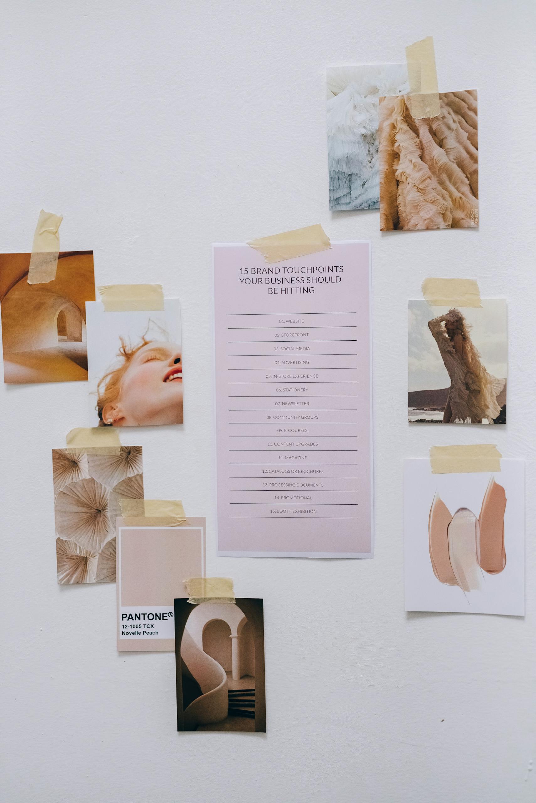 Aesthetic moodboard showcasing brand strategy concepts and design elements taped to a wall.